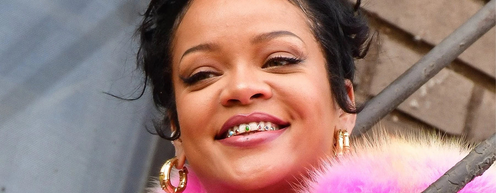 tooth gems rihanna wearing gold grillz